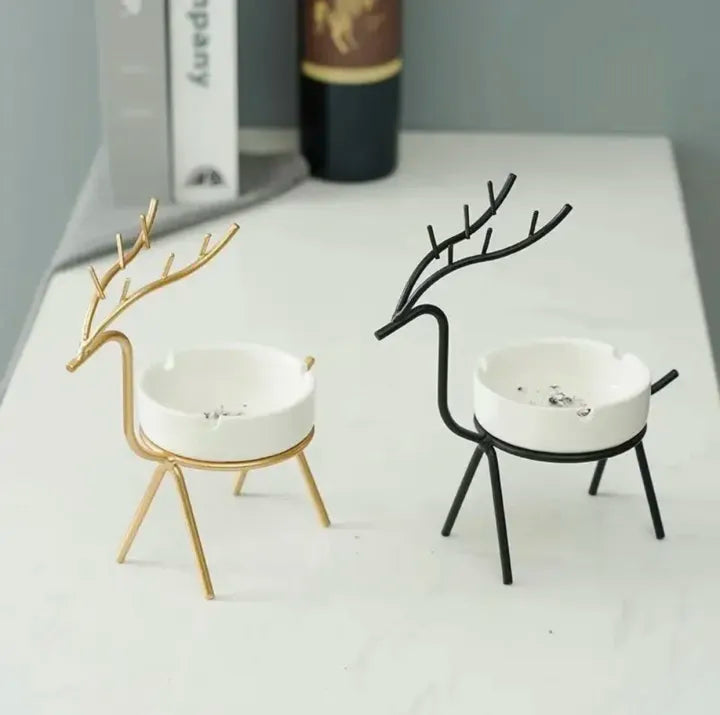 two Deer shaped ashtray one in gold and another one is black