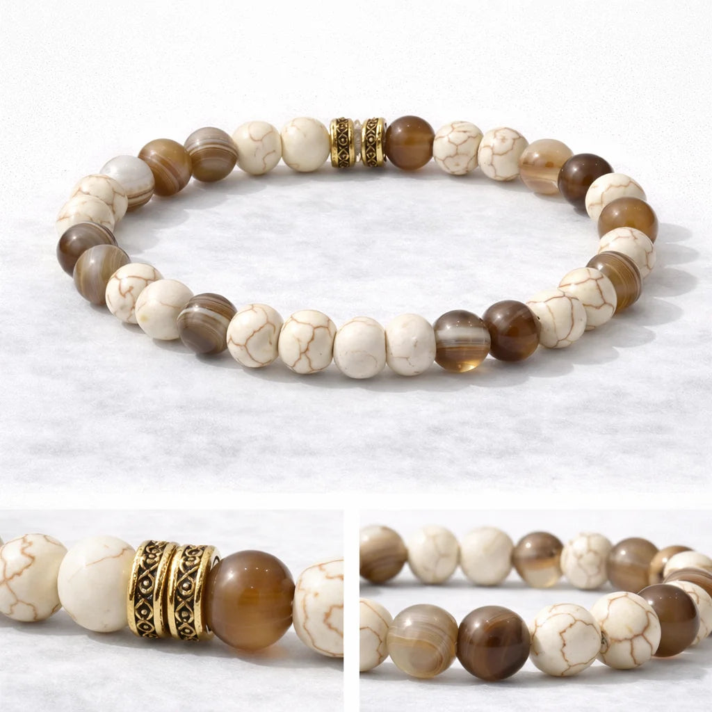 Beaded bracelet with brown and white stones on a light gray background