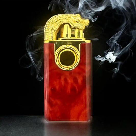 lighter with gold accents and red body, emitting smoke on a black background