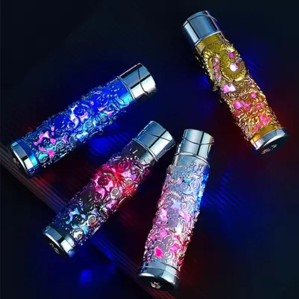 Four colorful lighters with glittery designs on a dark background