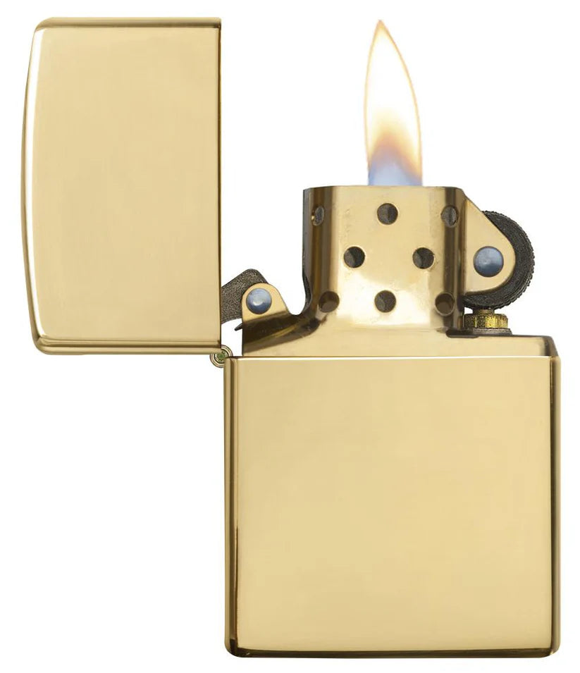 Gold lighter with flame on a white background