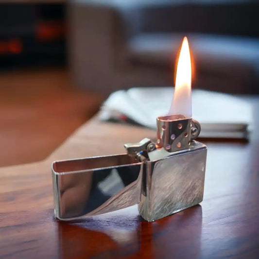 Silver flip-top lighter open lid flint wheel detail