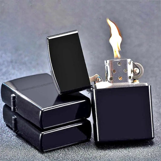 Black lighter with flame on a gray background