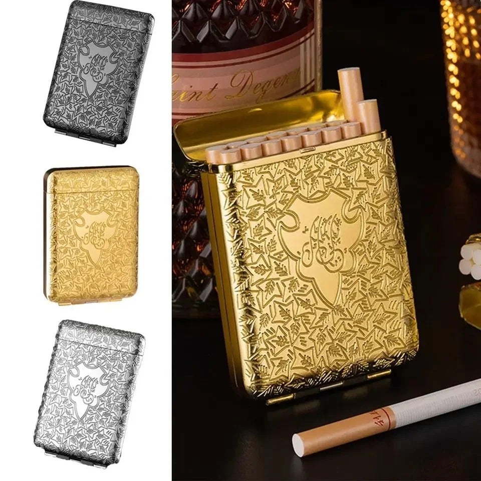 Gold, silver, and black cigarette cases with a bottle of Saint Regis in the background.