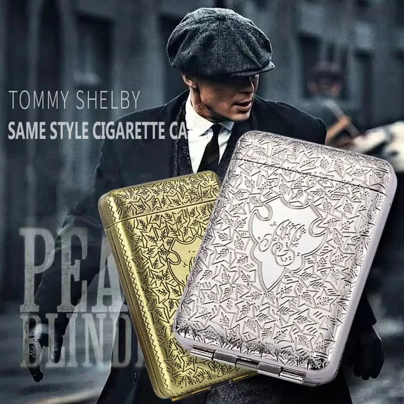 Two cigarette cases, one gold and one silver, front of person in a dark coat and cap.