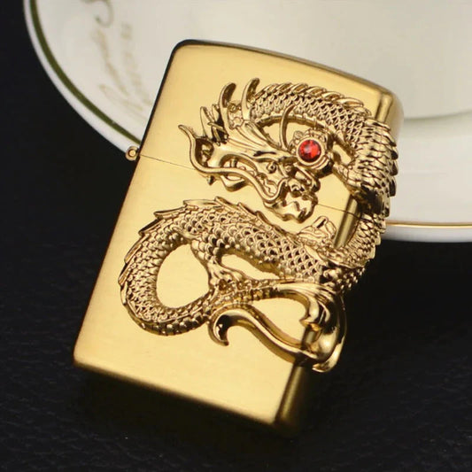 Gold lighter with dragon design on a dark background