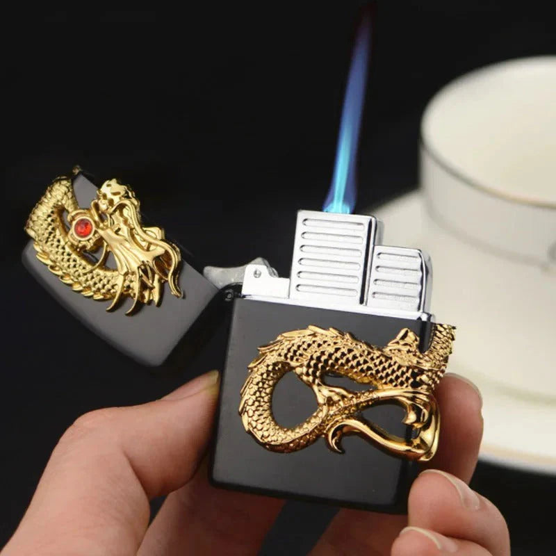 Lighter with gold dragon design held by a hand, with a blurred background