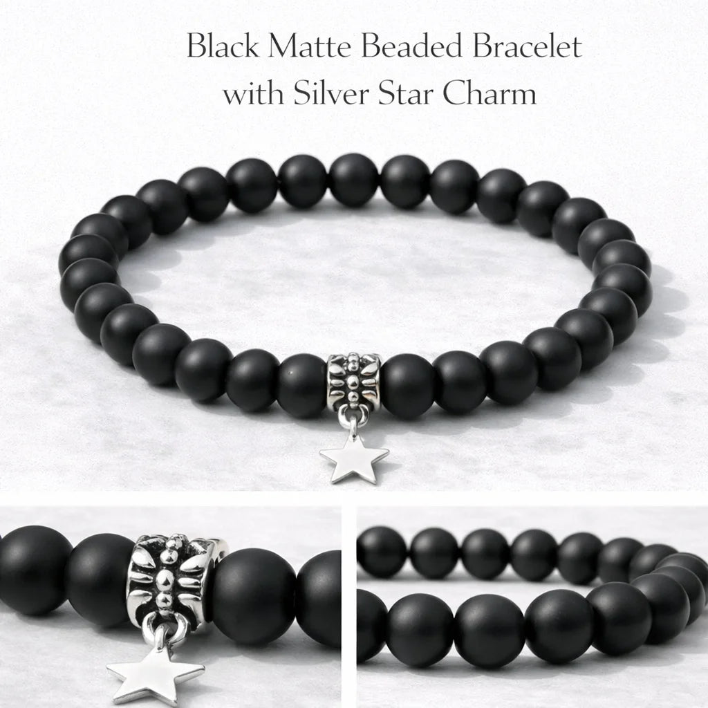 Black matte beaded bracelet with silver star charm on a light background