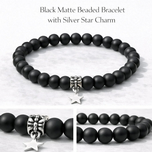 Black matte beaded bracelet with silver star charm on a light background
