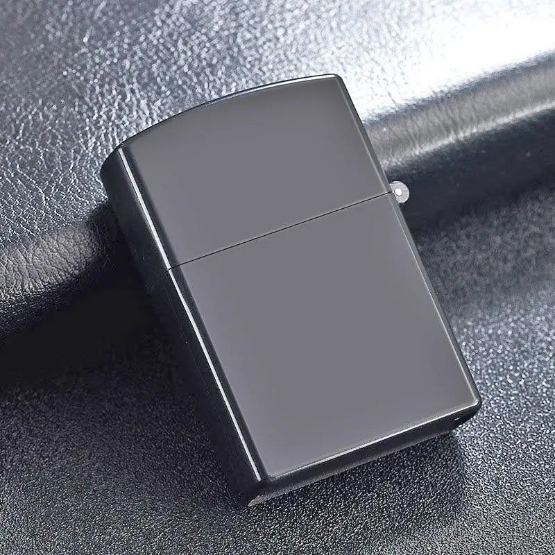 Black zippo lighter on a dark textured surface