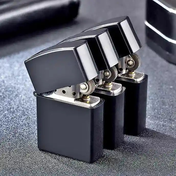 Black and silver zippo lighter on a textured surface