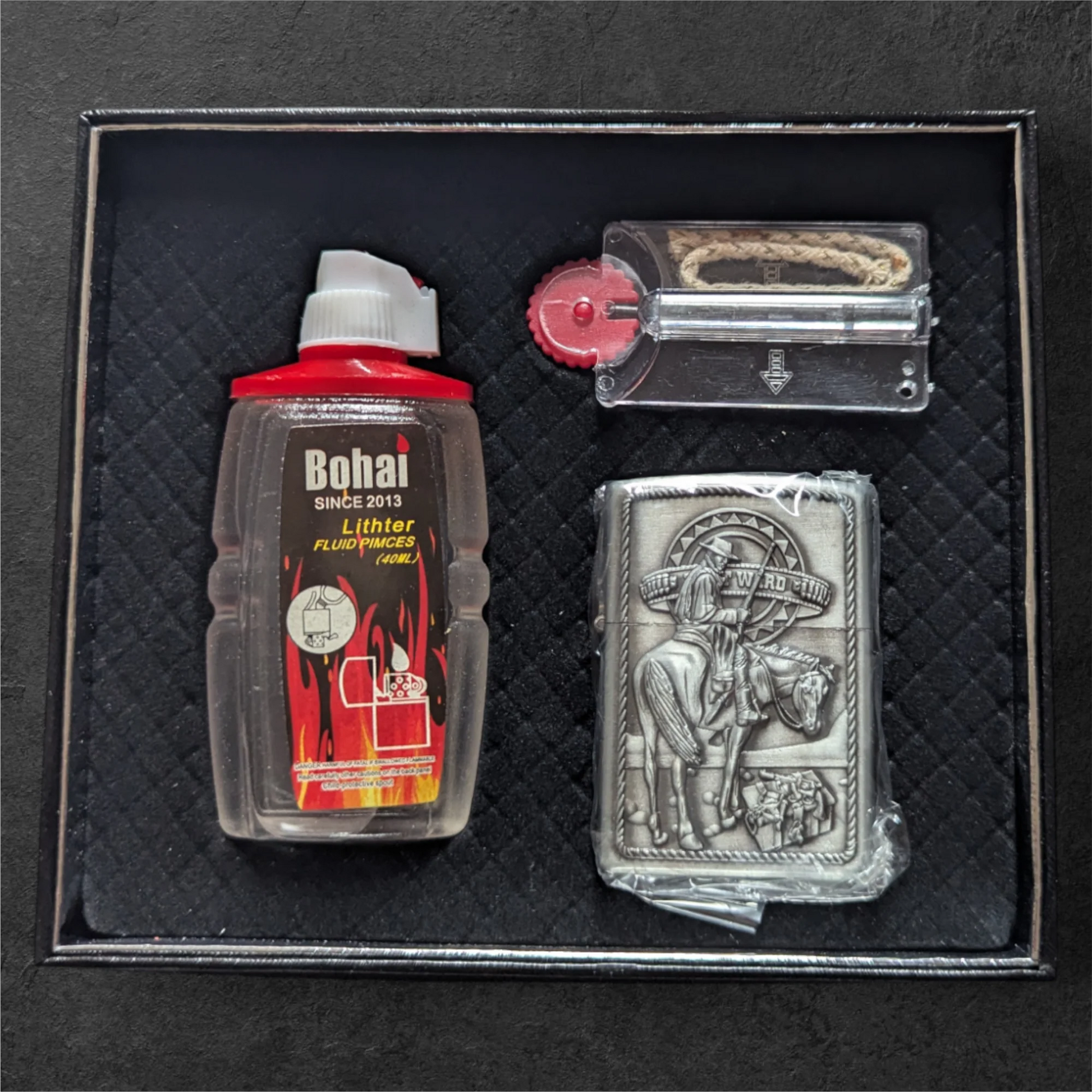 Bohai Zippo lighter, fluid and flints in a black box.