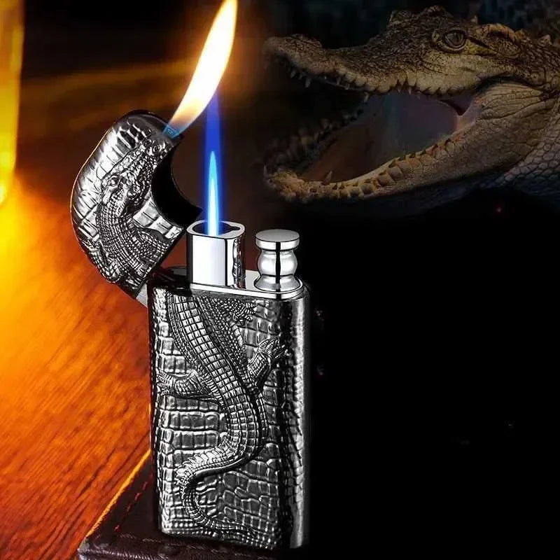 Crocodile-patterned lighter with flame on a dark background