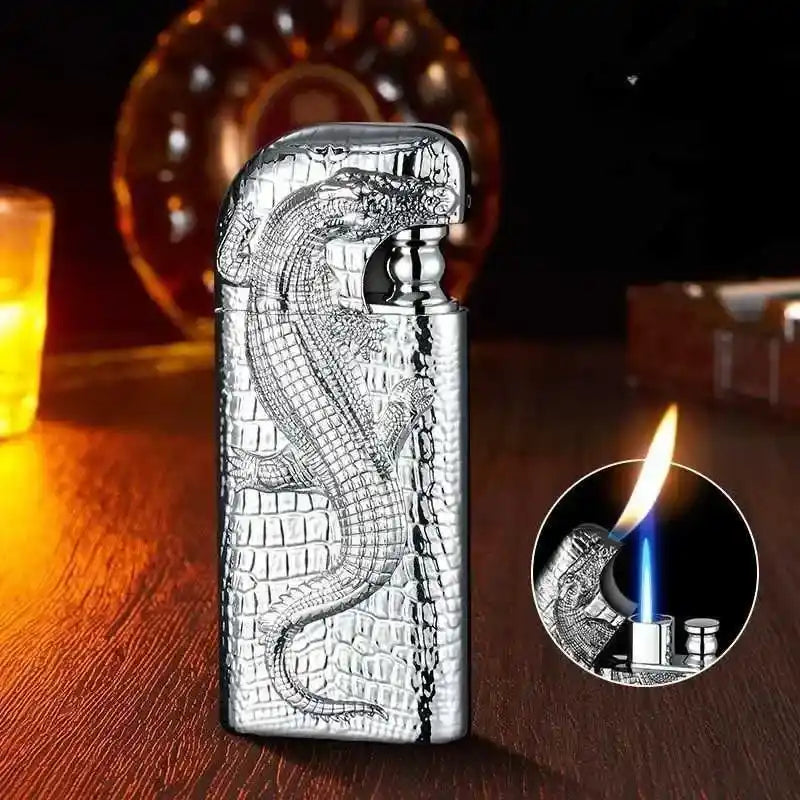 Metallic lighter with crocodile design on a wooden surface, with a close-up of the flame.