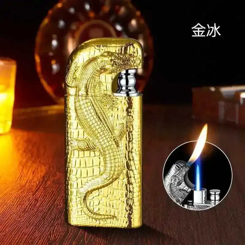 Gold lighter with snake design on a wooden surface, inset showing flame.