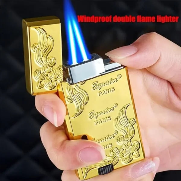 Gold lighter being held with a visible flame, brand 'Egaux' on display.