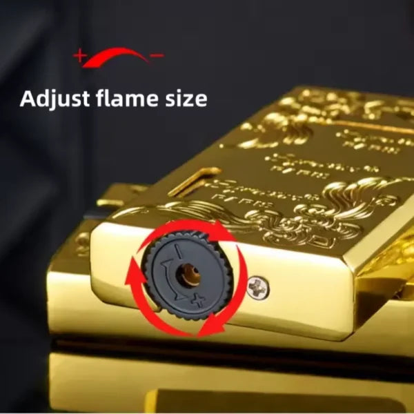 Gold lighter with flame size adjustment feature on a black background