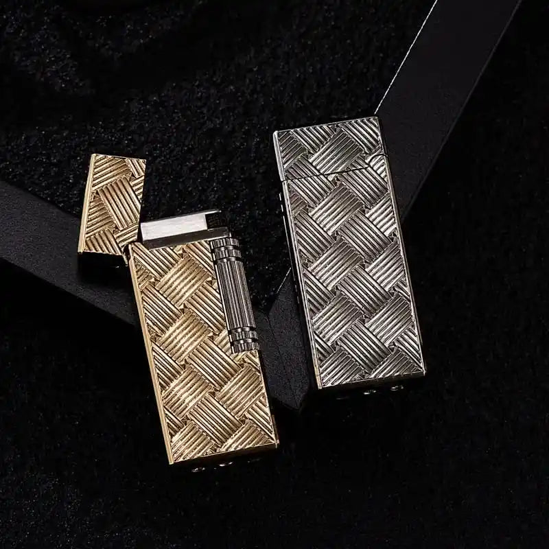 Two metallic lighters with woven design on a black background