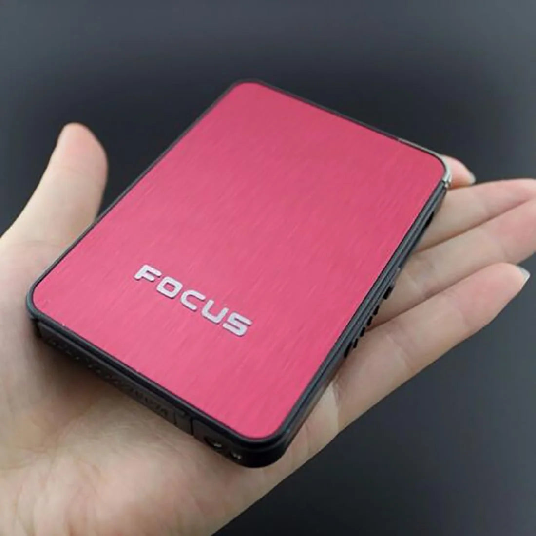 Red FOCUS Cigarette Case product JD-YH003 held in a hand against a dark background