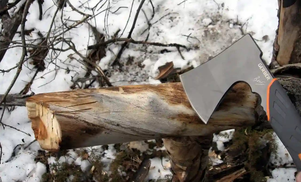 Axes on a log with a snowy background