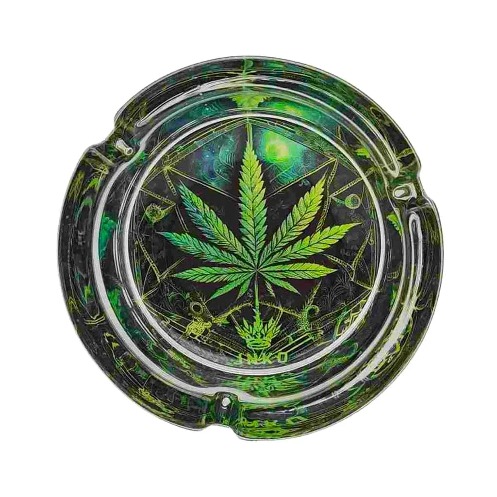 Glass ashtray with green cannabis leaf design on a white background
