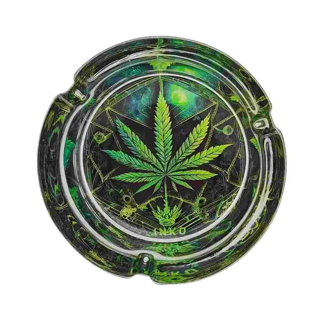 Glass ashtray with green cannabis leaf design on a white background
