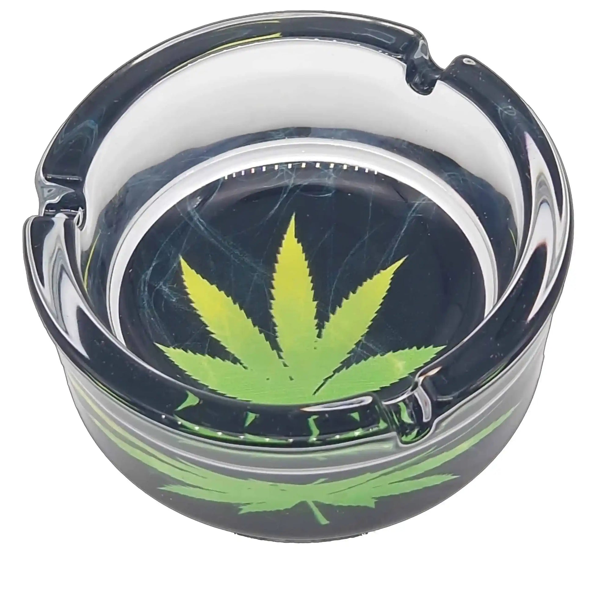 Clear ashtray with a green cannabis leaf design on a white background