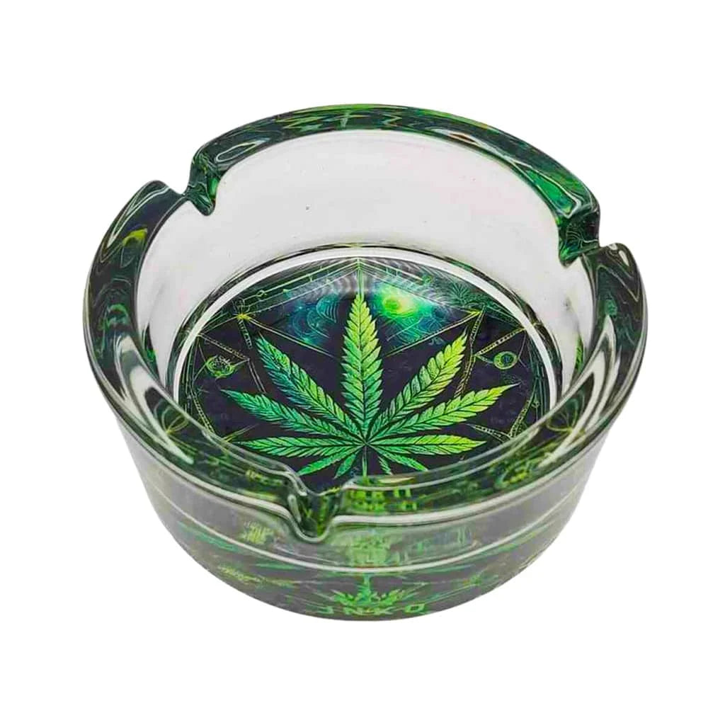 Glass ashtray with cannabis leaf design on a white background