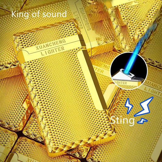Gold lighter with 'XUANCENG LIGHTER' branding on a gold background, featuring the text 'King of sound' and 'Sting'.