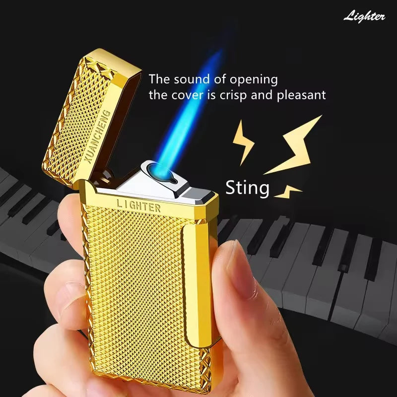 Gold lighter being held with a piano keyboard in the background