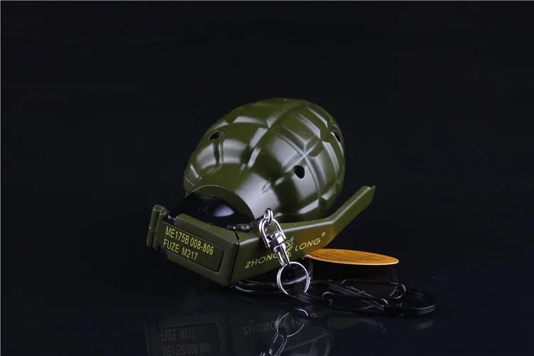 Green lighter with a keychain on a black background