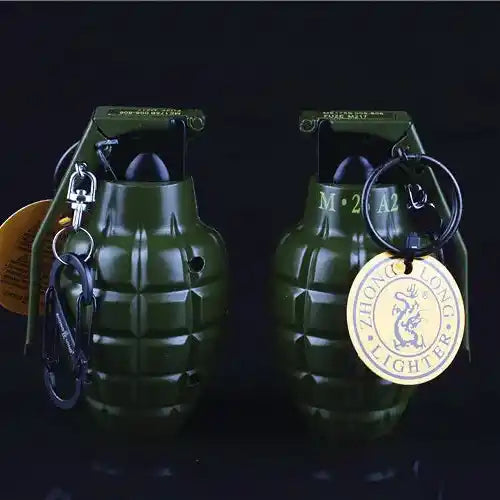 Two green grenades Lighter with keychains on a black background
