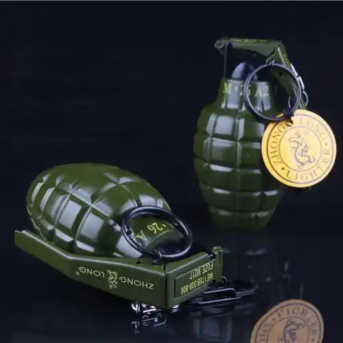 Two green grenades Lighter with gold tags on a black background