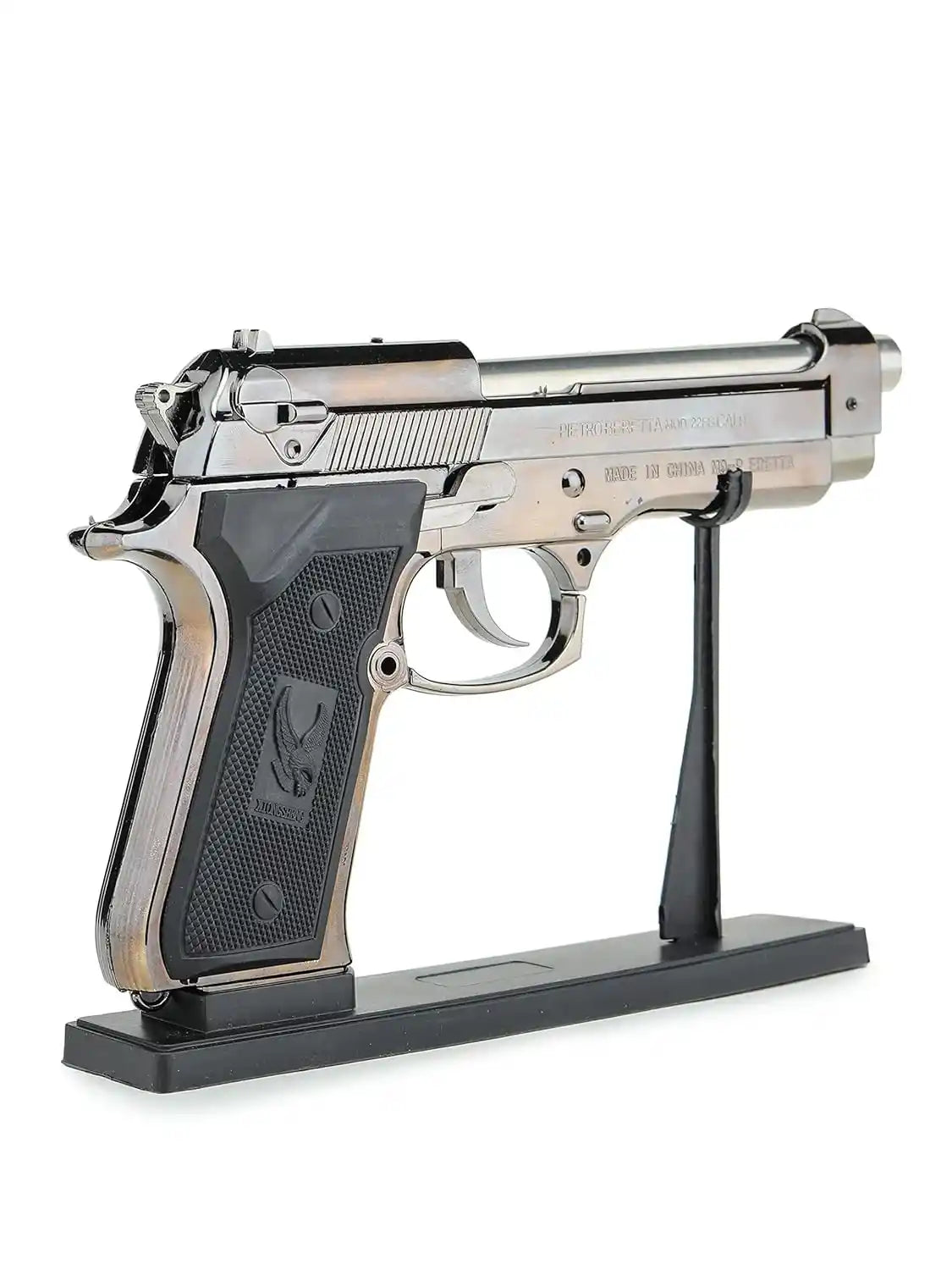 Decorative gun lighter model on a stand with a white background