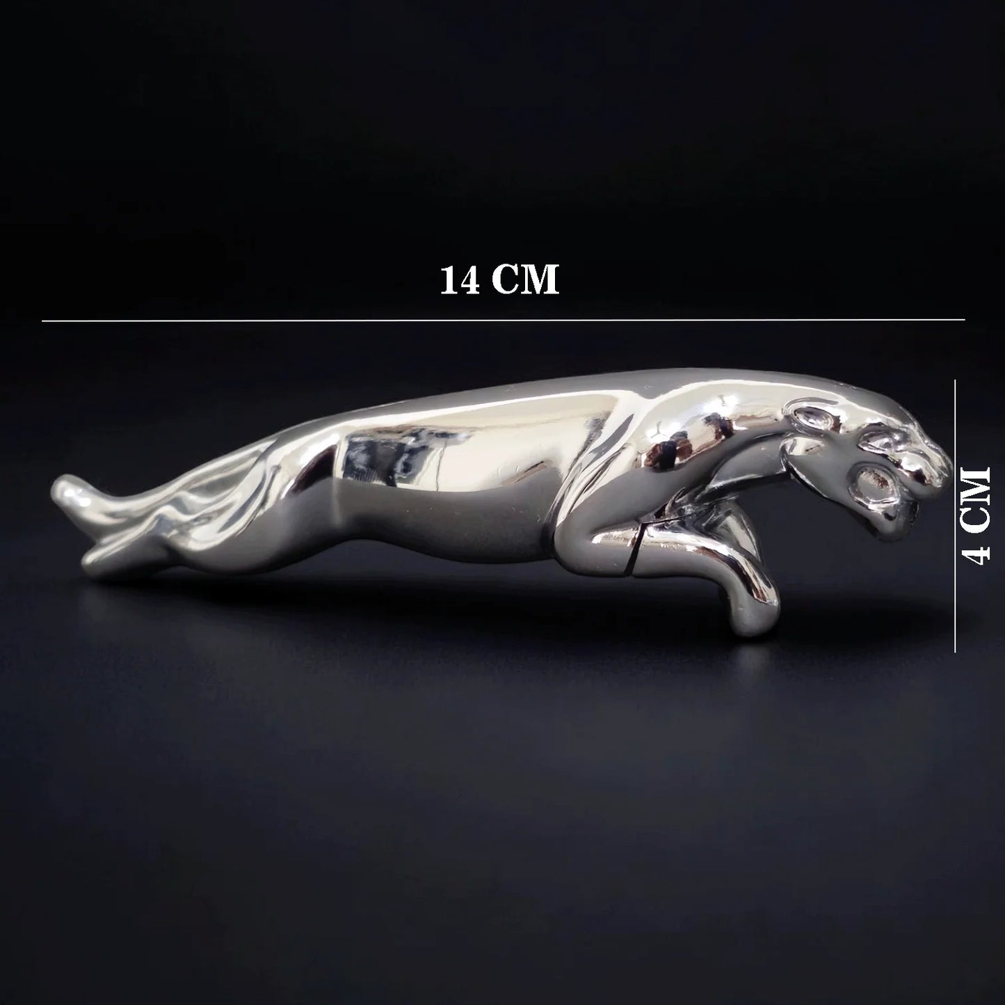 Silver Jaguar -shaped Lighter with measurements on a black background