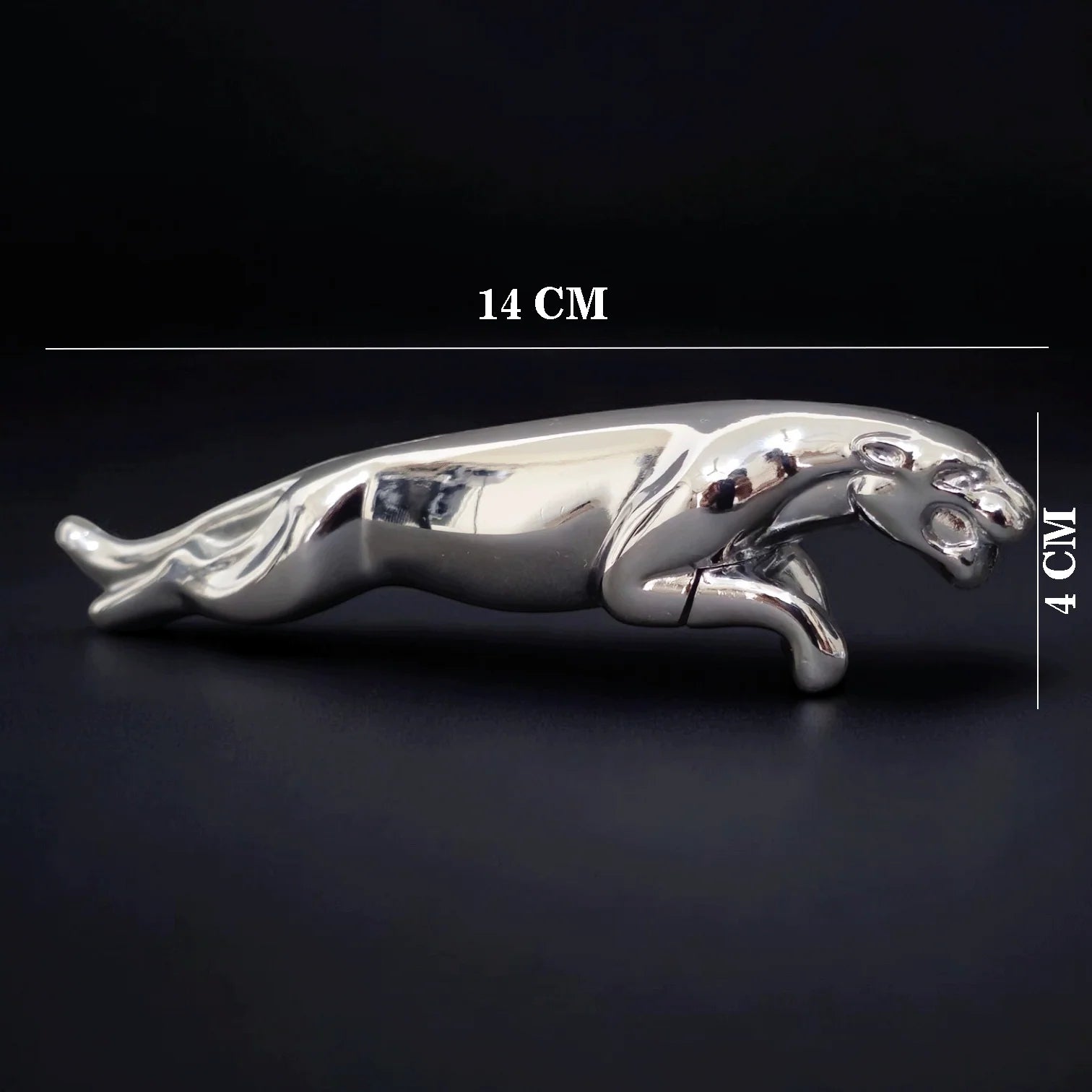 Silver Jaguar -shaped Lighter with measurements on a black background