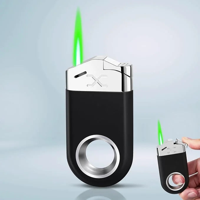 Black and silver lighter with green flame on a light blue background