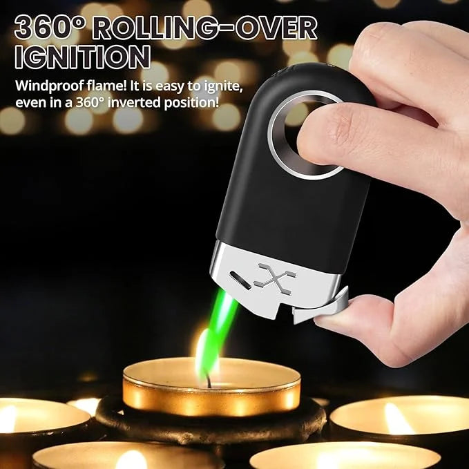 Hand holding a windproof lighter with a green flame over candles on a dark background.
