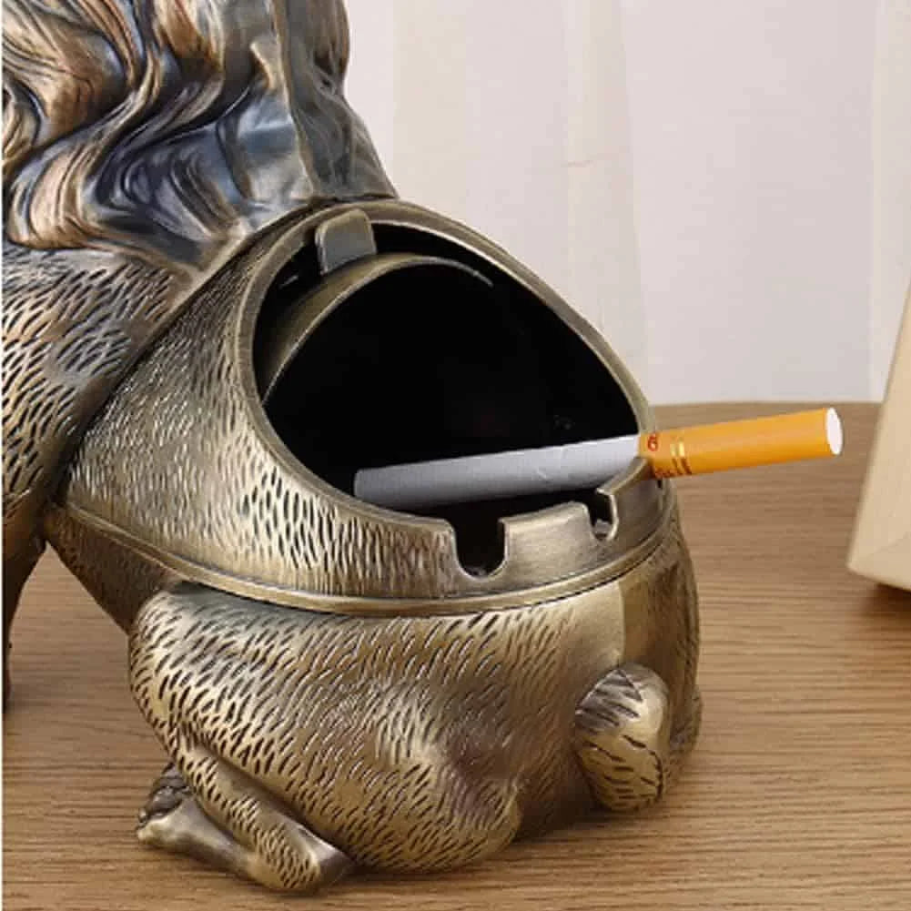 Metal Lion Ashtray unsing Cigarette in it from backside