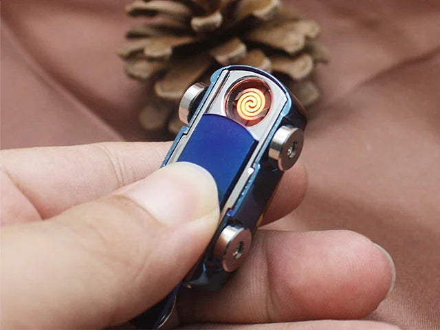Hand holding a blue lighter with a pine cone in the background