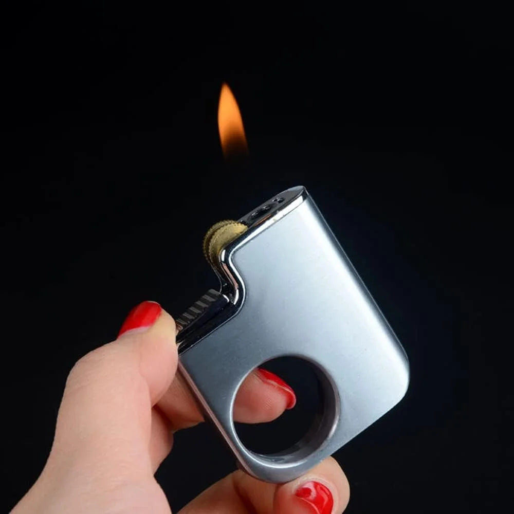 Hand holding a silver lighter with flame against a black background