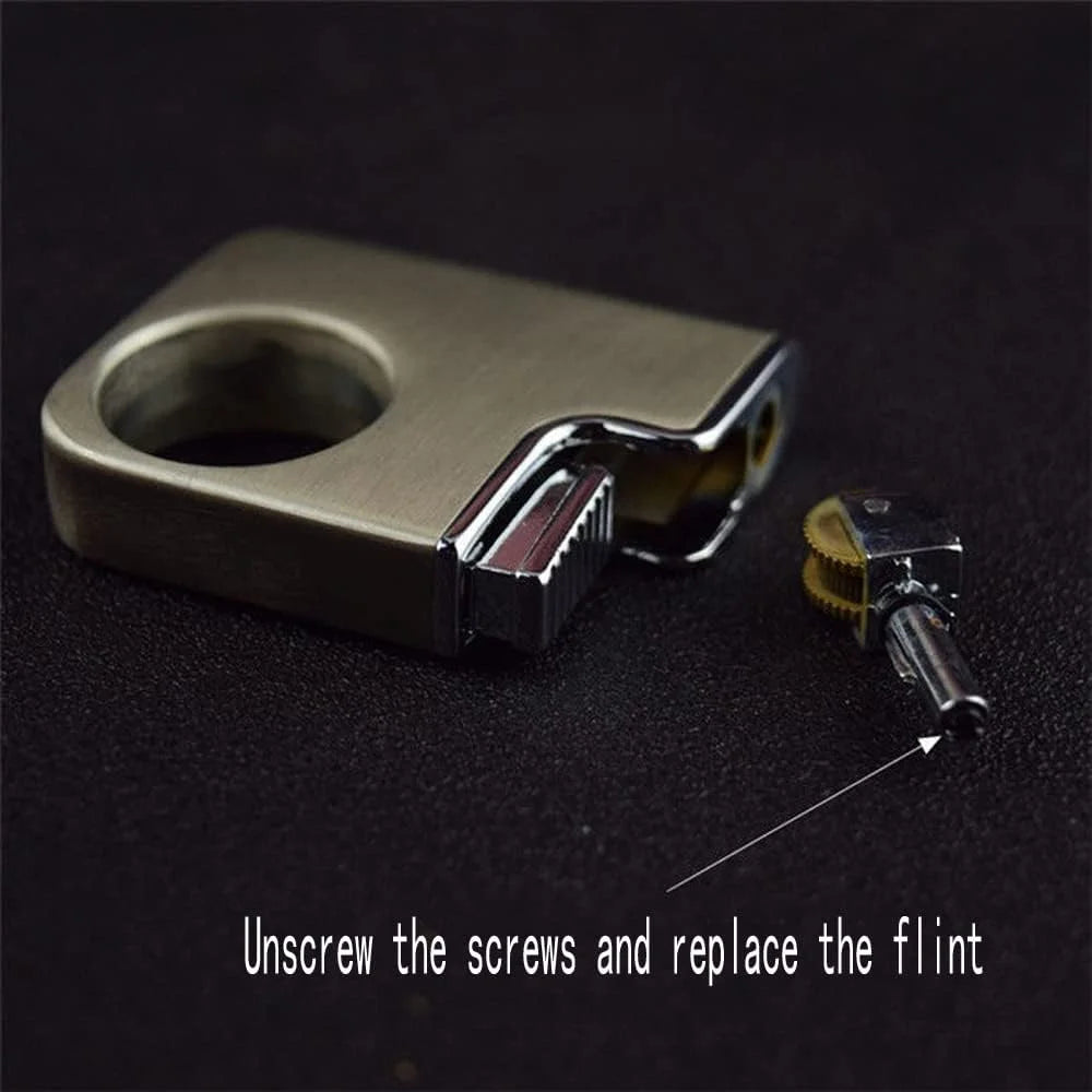 Metal lighter with screws and flint on a dark background