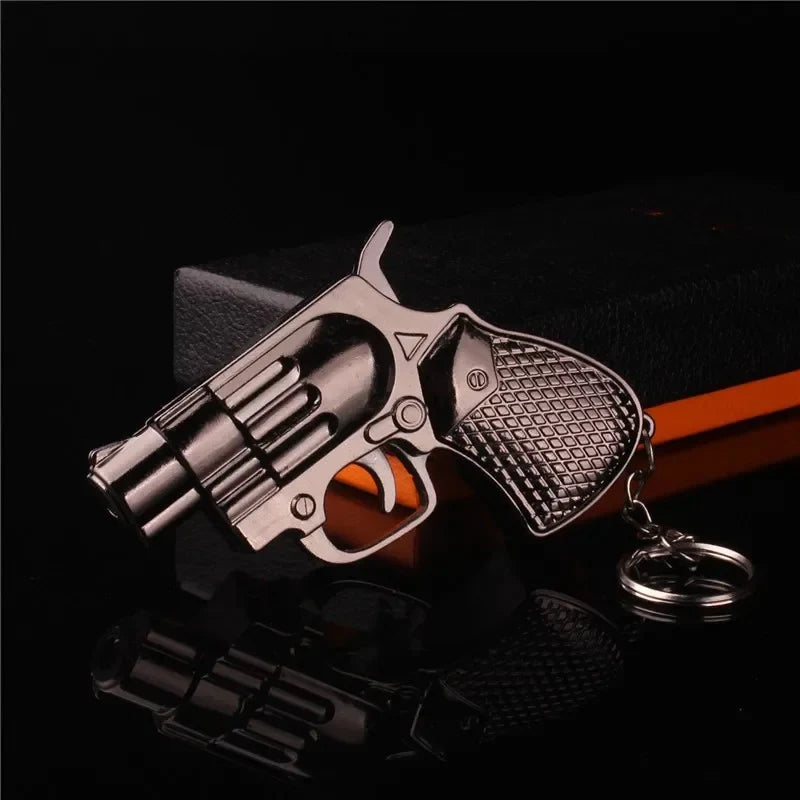 Revolver-shaped Lighter with keychain on a dark background