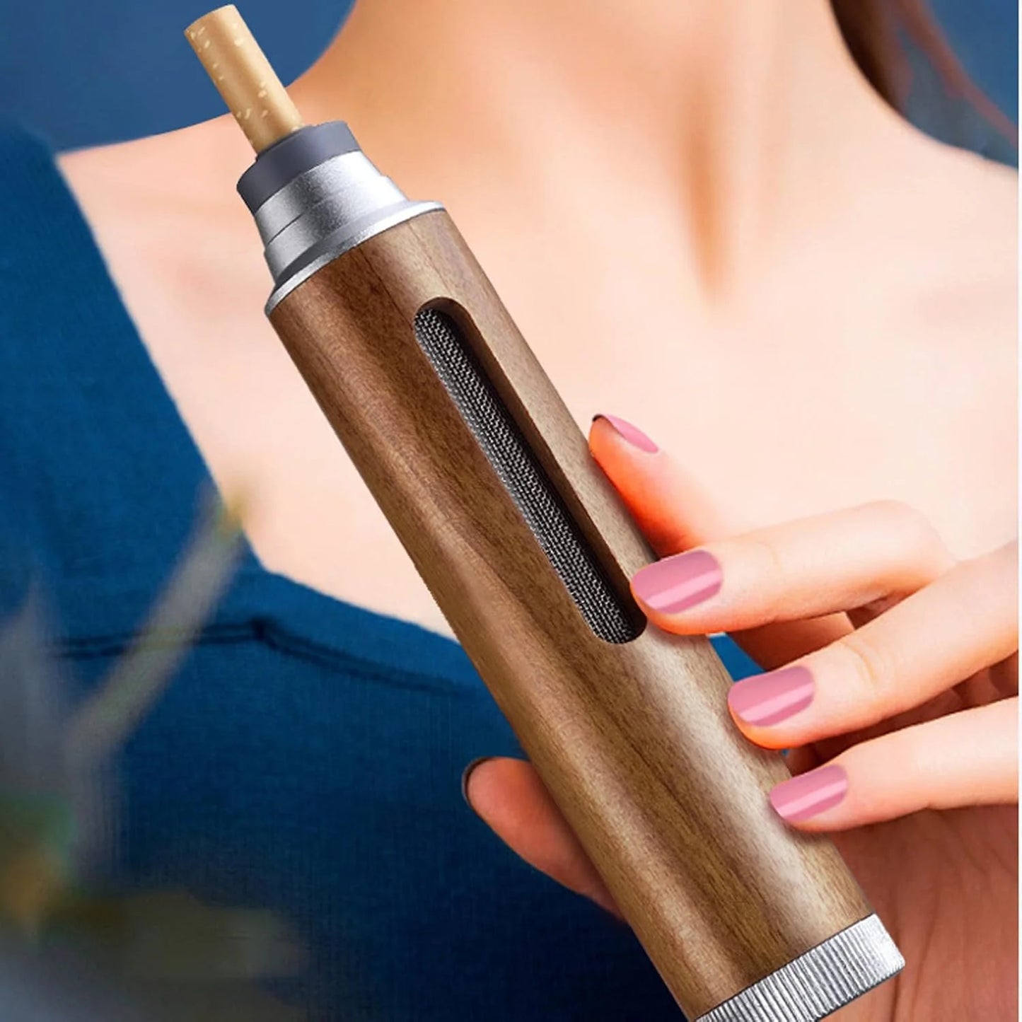 Wooden portable mini car ashtray held by a person with pink nail polish