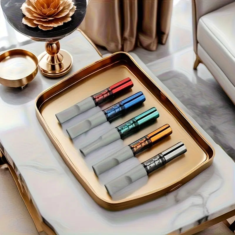 Set of colorful filter on a gold tray with a marble surface background