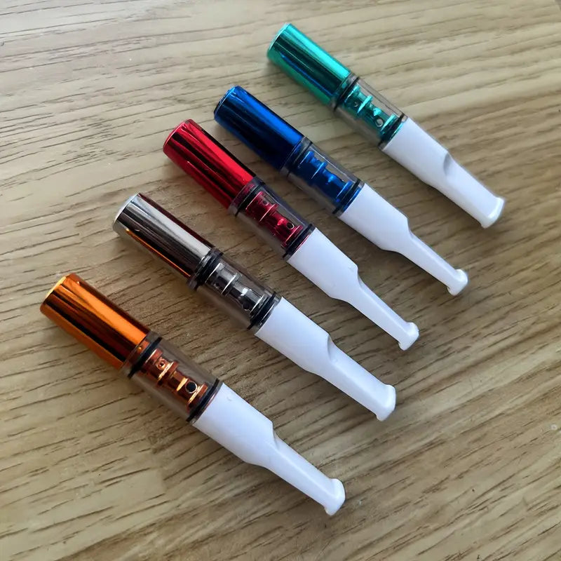 Five colorful Filter with white tips on a wooden surface