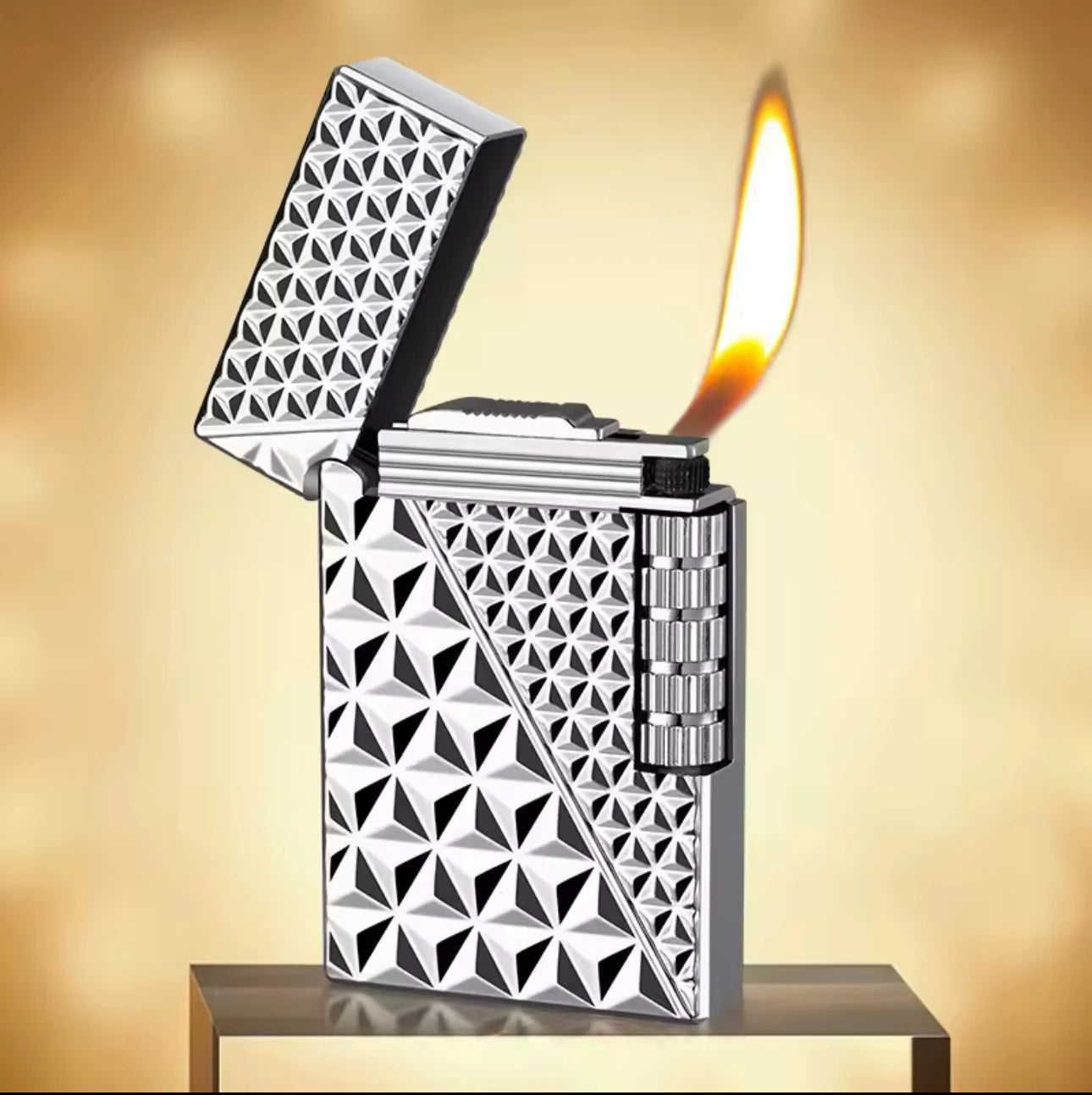Metallic lighter with geometric pattern on a reflective surface