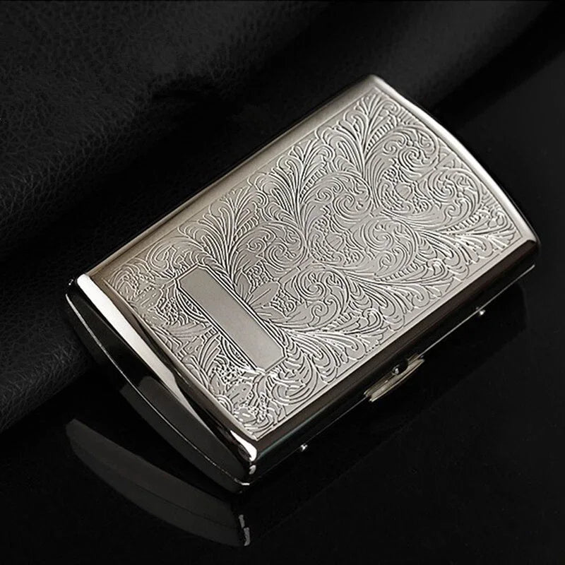 Silver embossed cigarette case on a white background