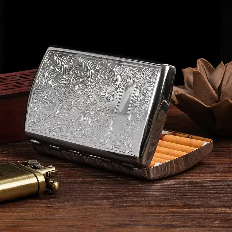 Silver embossed cigarette case on a white background