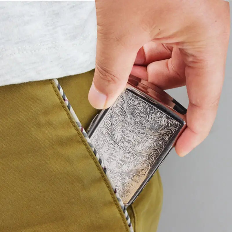 Silver embossed cigarette case on a white background